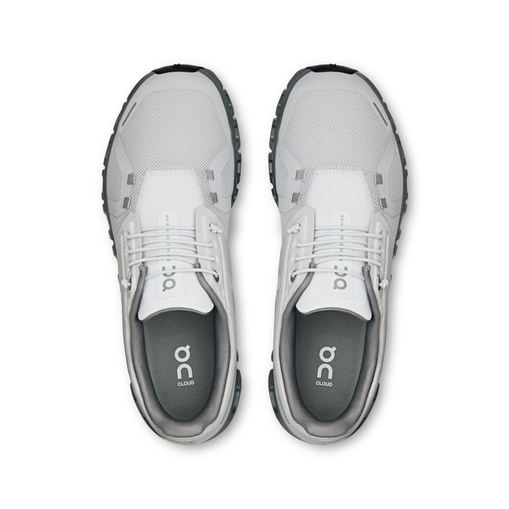 Pair of gray and white athletic shoes on a white background