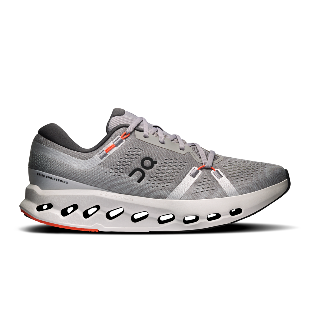 A gray On running shoe with a white midsole and small orange accents, shown from the side on a white background.