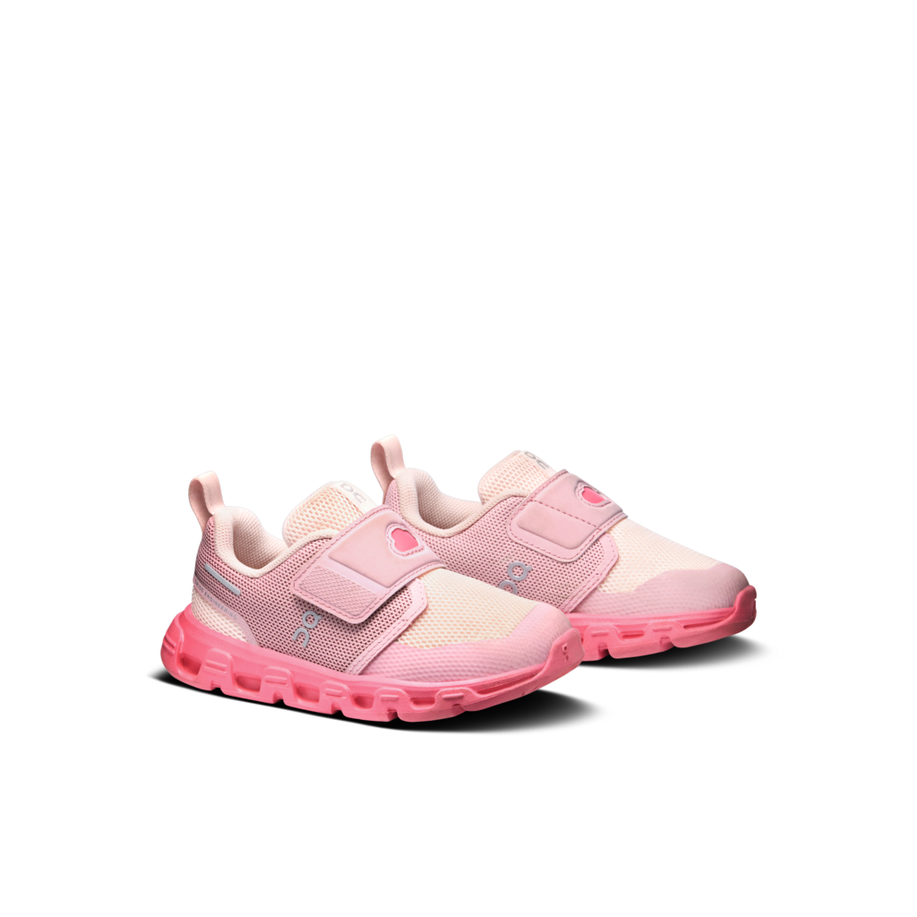 Pair of pink children's sneakers on a white background