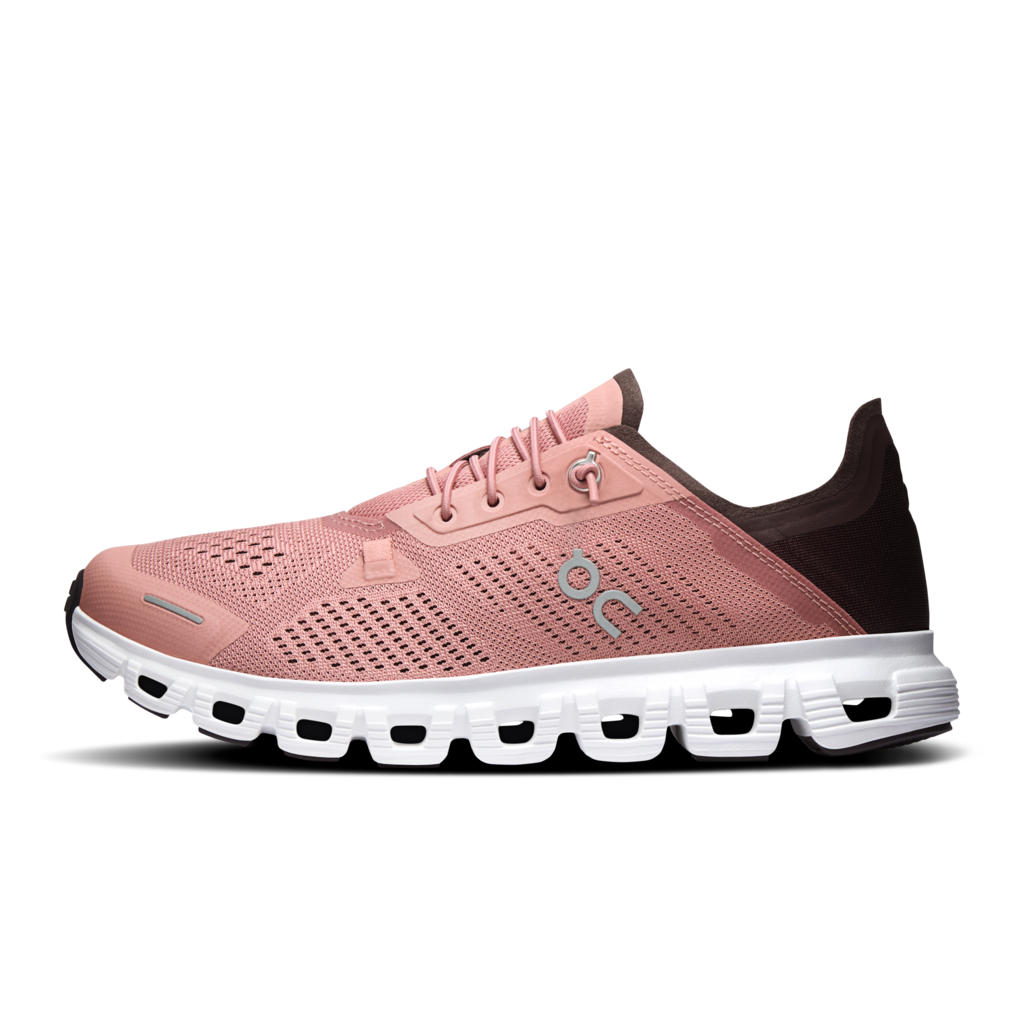 A single On running shoe in light beige and navy blue, shown from a side profile view against a white background.