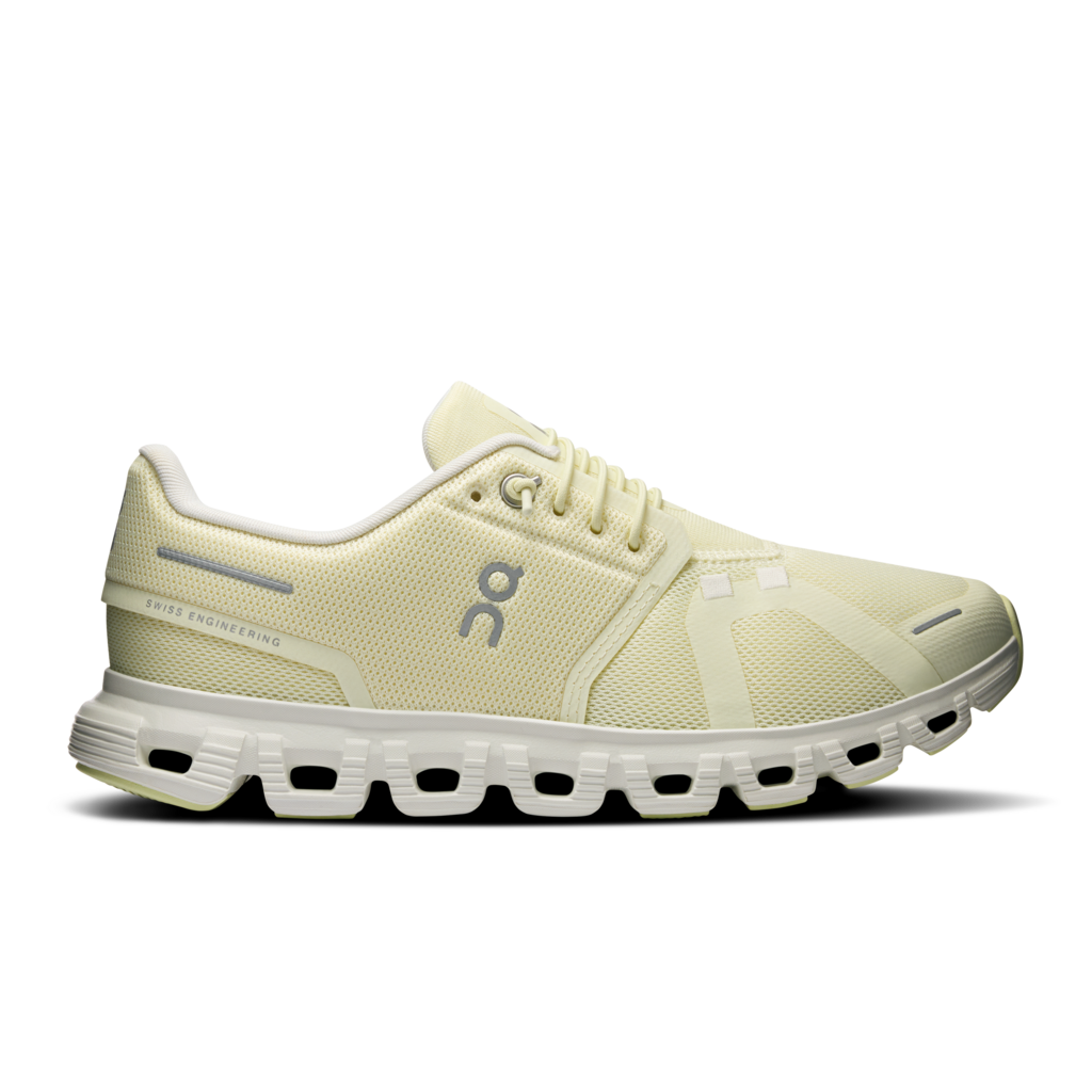 Light-colored running shoe with a visible brand logo on a white background