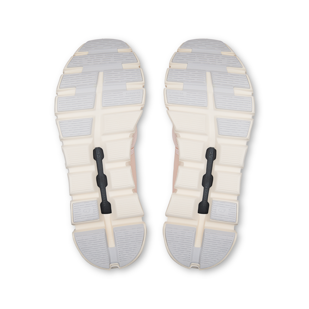 Top view of a pair of sandals with white soles and straps on a white background