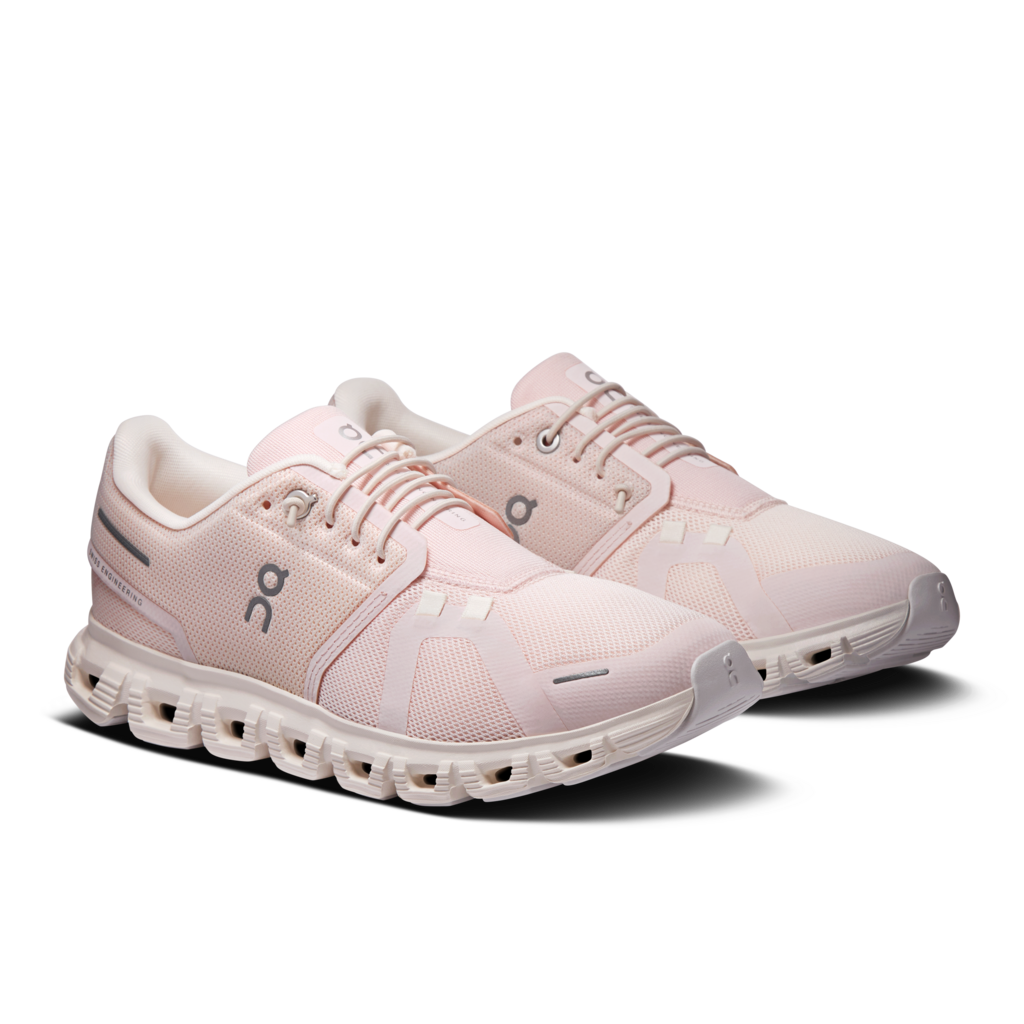 Pair of pink running shoes on a white background