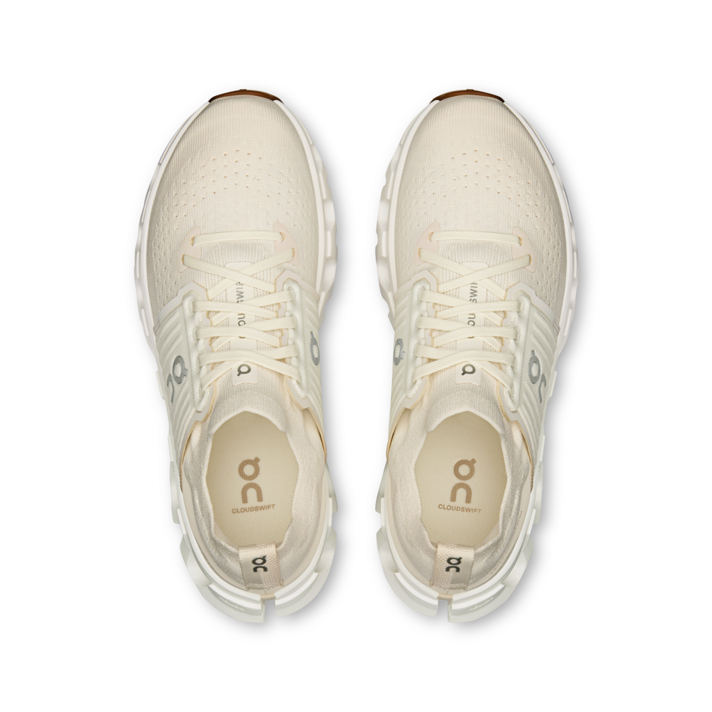 Pair of white running shoes on a transparent background