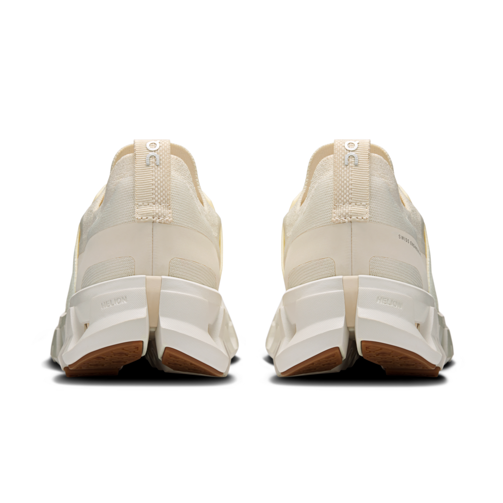 Pair of beige sneakers with white soles on a transparent background