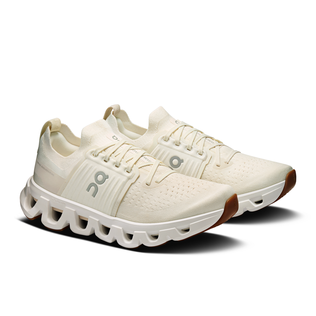 White running shoes with a unique sole design on a transparent background