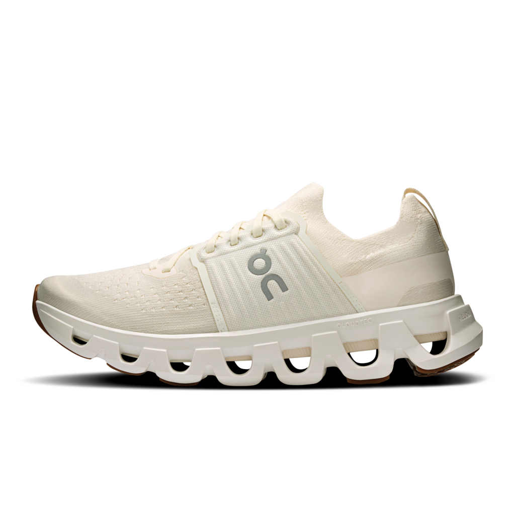Light blue and beige running shoe with a visible brand logo on a white background