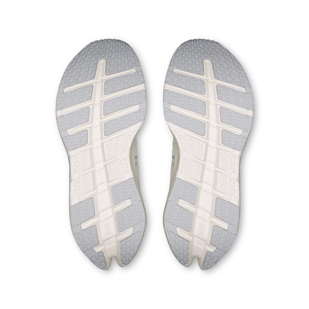 Top view of gray shoe insoles with white sole pattern on a white background