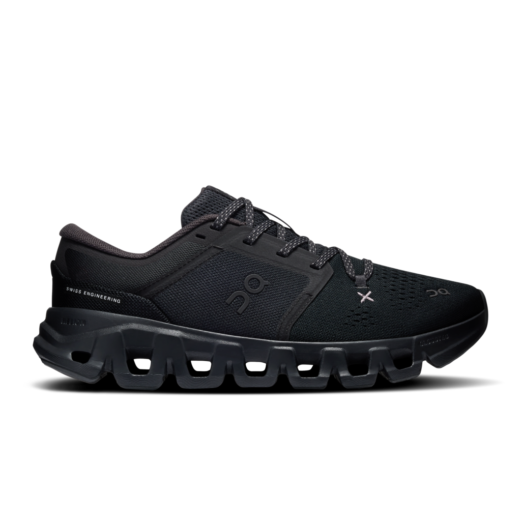 A black On running shoe with a chunky, segmented sole and subtle silver branding details, shown from a side profile on a white background.