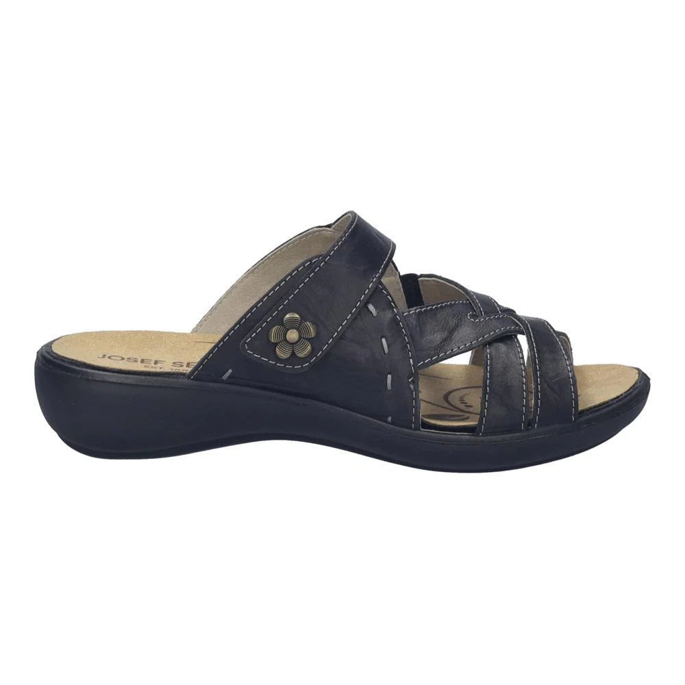 Navy blue sandal with a floral design on a white background