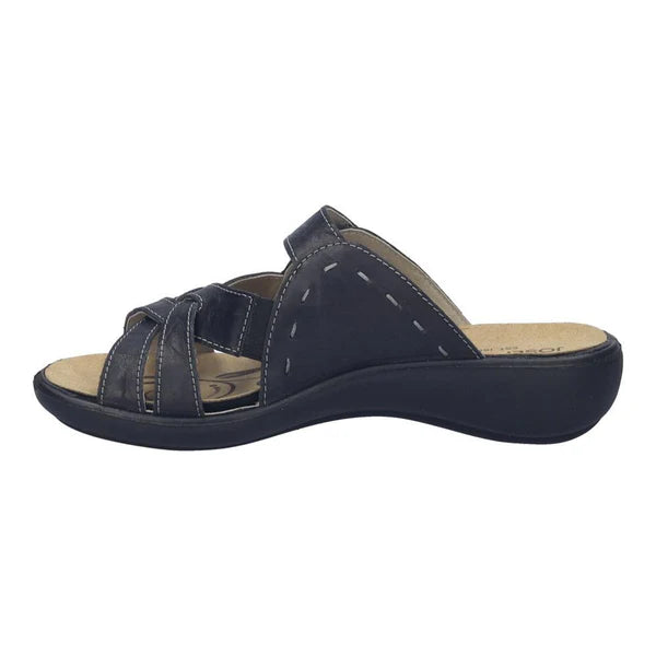 Navy blue sandal with a beige insole on a white background