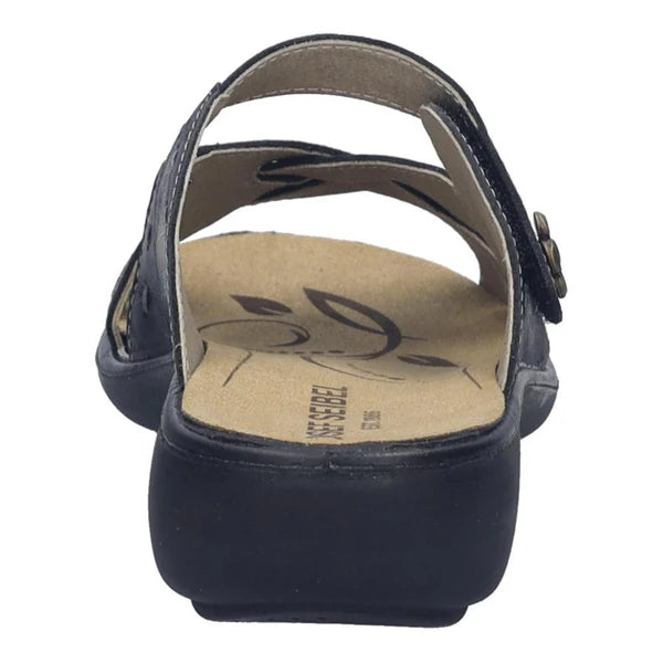 Navy blue sandal with a tan insole on a white background