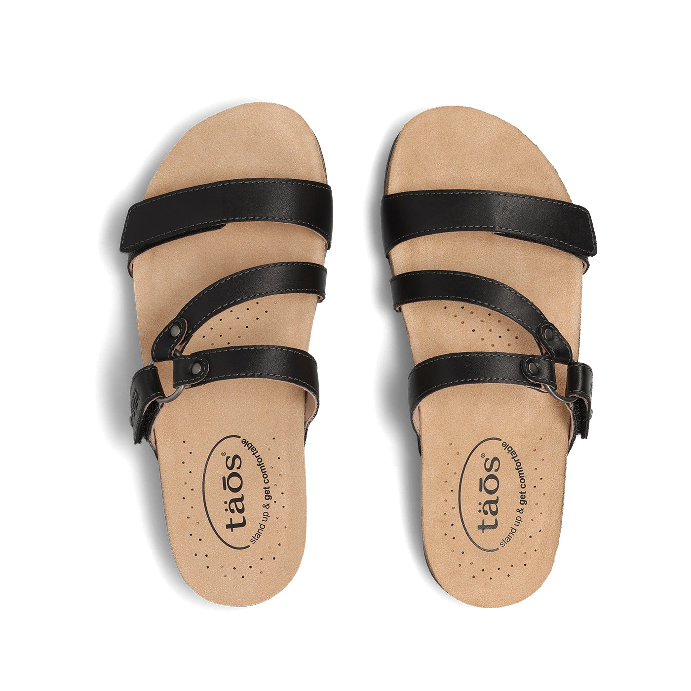 Pair of tan sandals with black straps on a white background