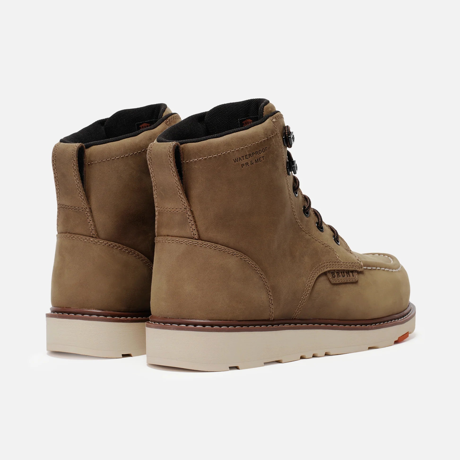 Pair of brown leather boots on a white background