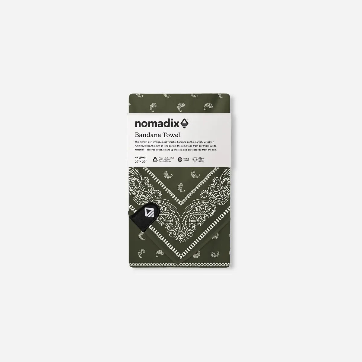 A folded Nomadix Bandana Towel in olive green with a white paisley pattern, shown with its white paper label packaging on a light gray background.