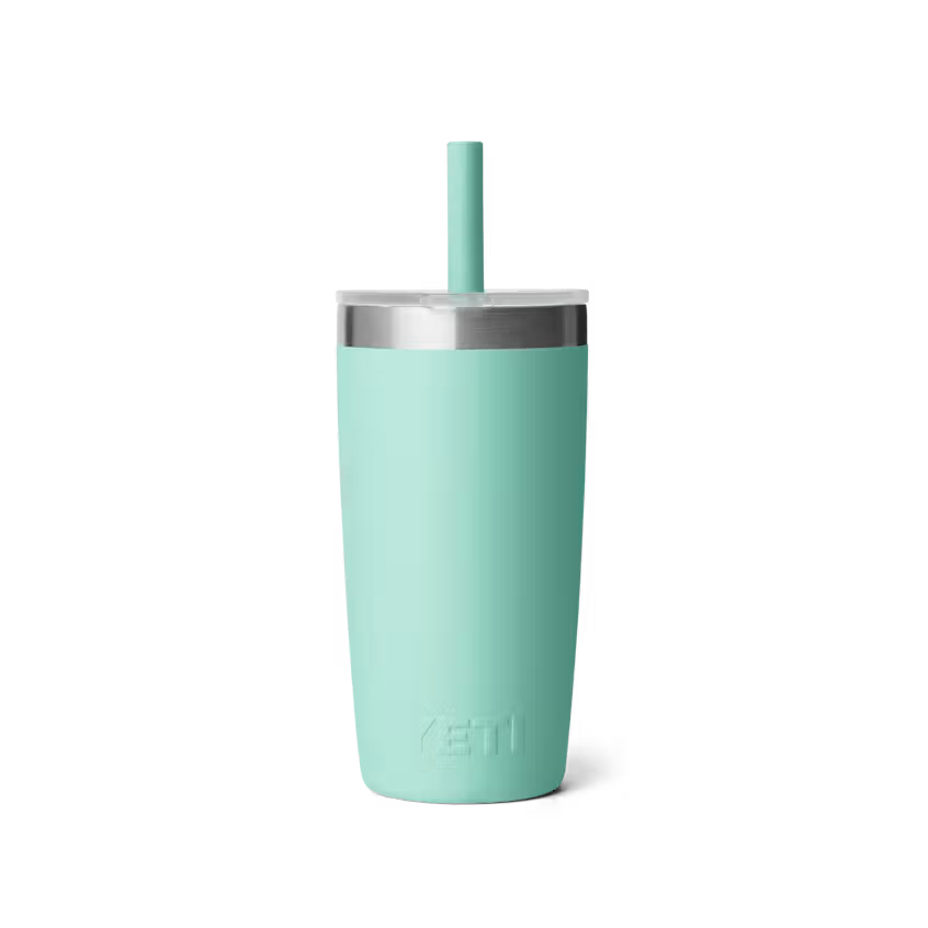 Mint green tumbler with a straw on a white background