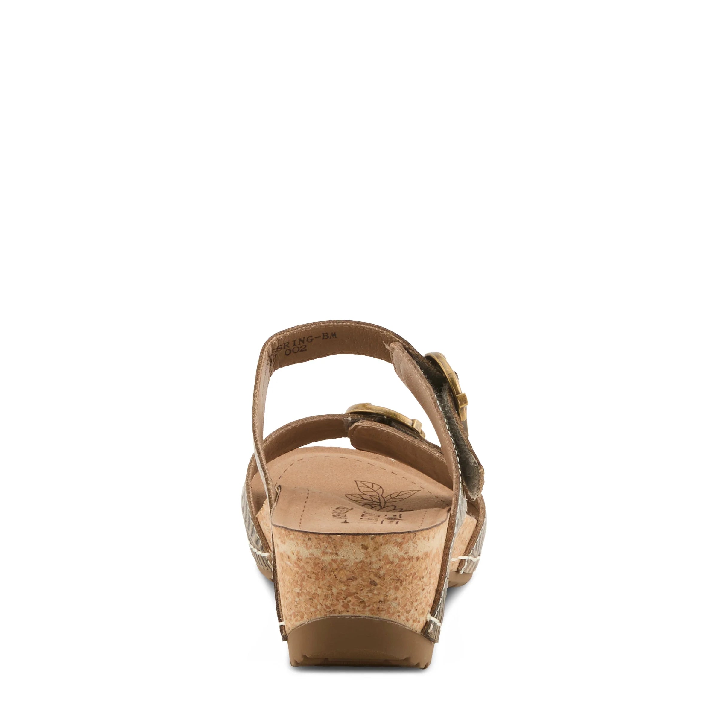 Brown sandal with cork wedge sole on a white background