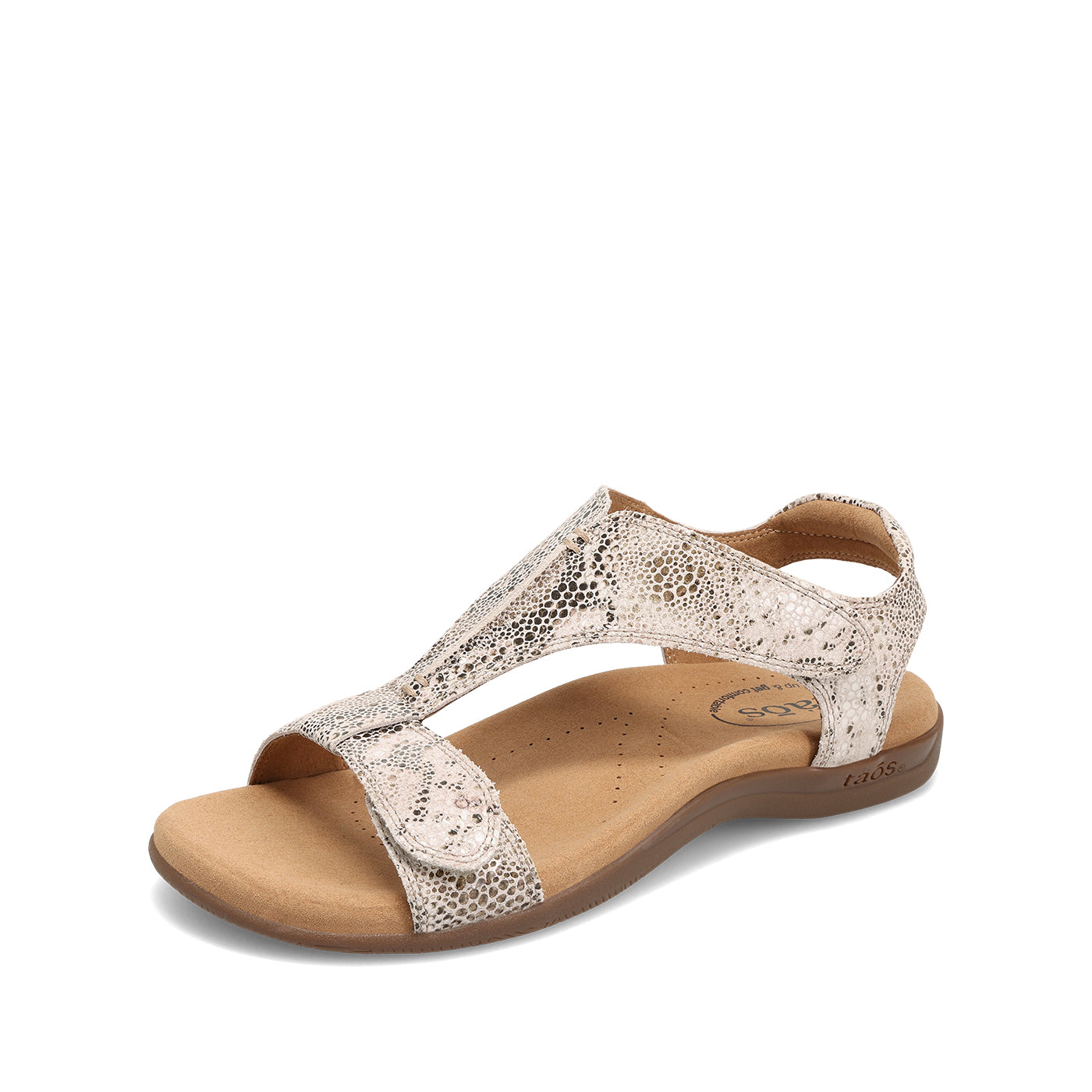 Beige sandal with metallic accents on a white background