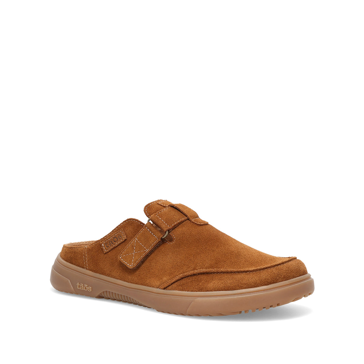 A single tan suede mule shoe with a hook-and-loop strap closure and a gum rubber sole, shown from a side profile on a white background.