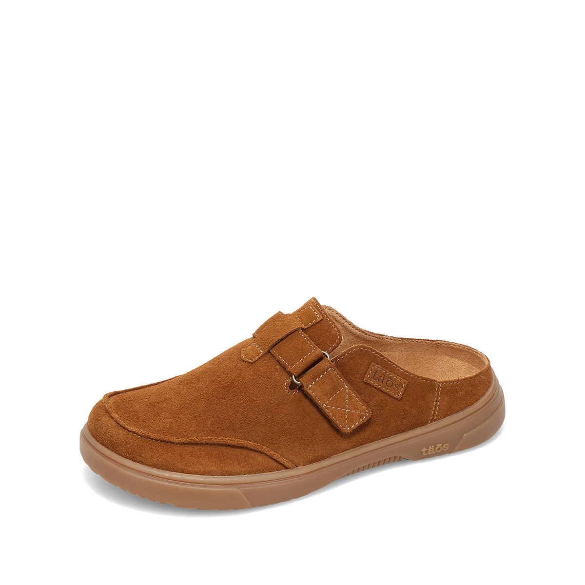 A single brown suede clog-style shoe with a hook-and-loop strap closure and a gum sole, shown from a side angle on a white background.