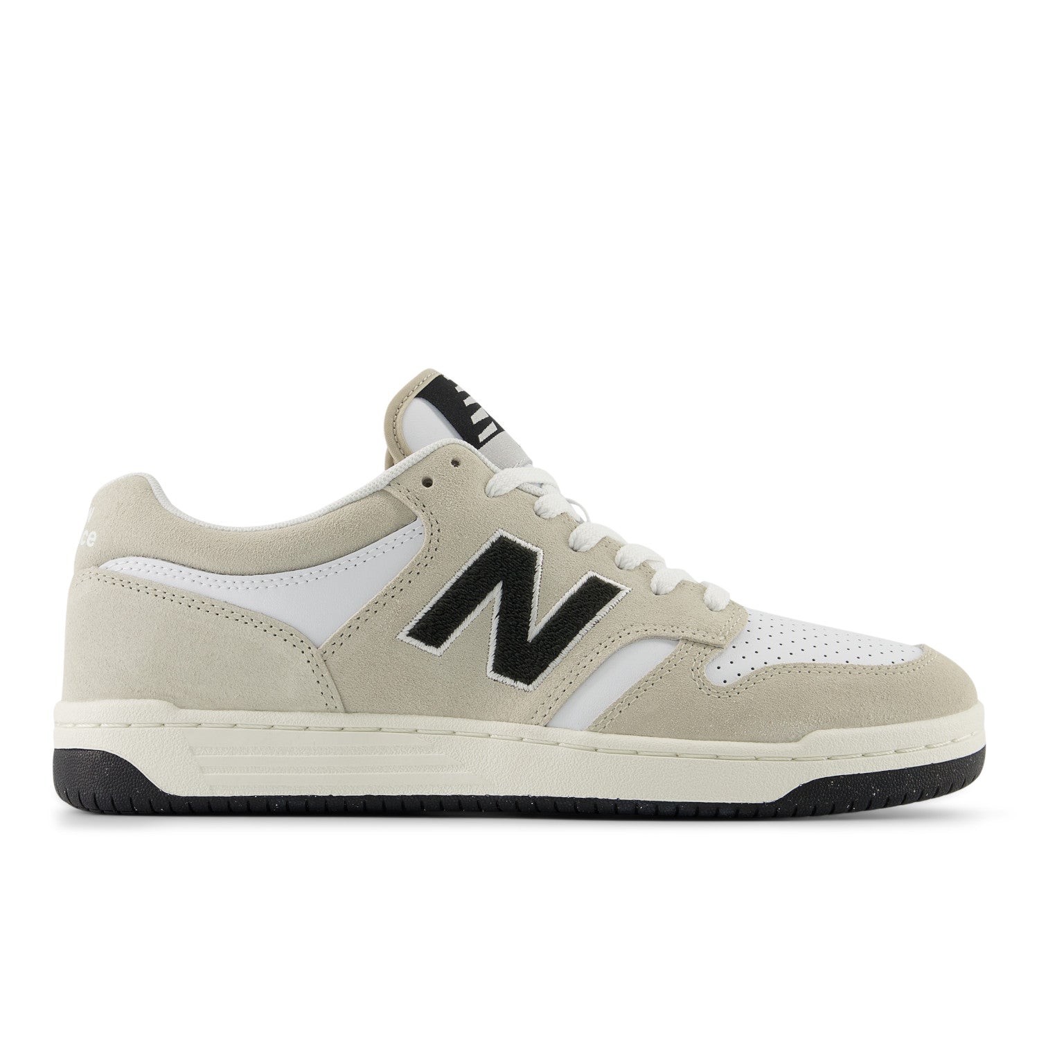 Beige sneaker with black logo on a white background