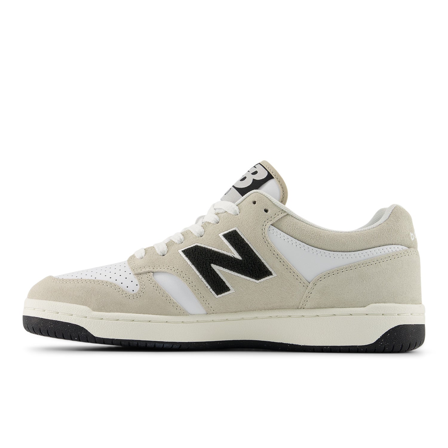 Beige sneaker with black logo on a white background