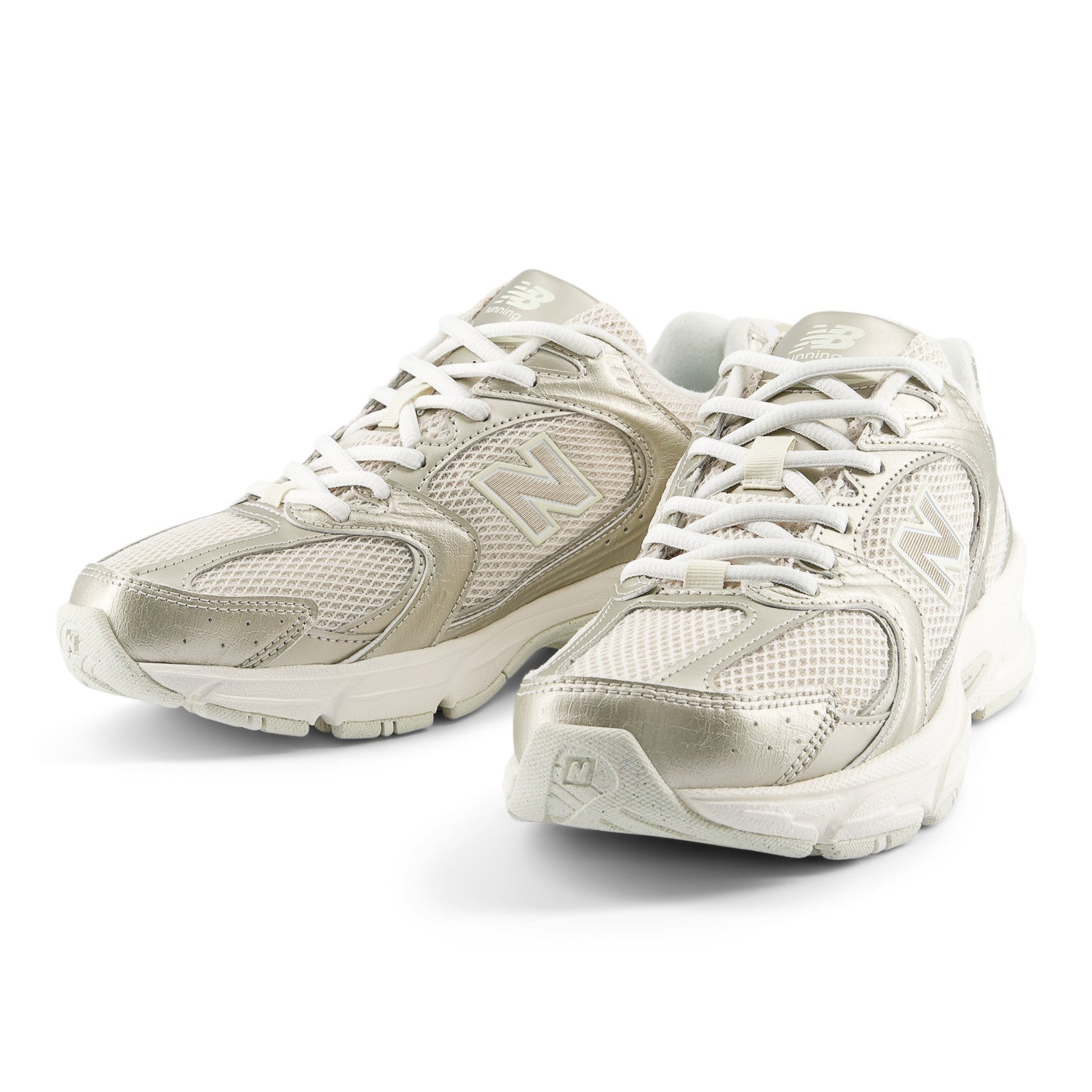 Pair of white sneakers on a white background