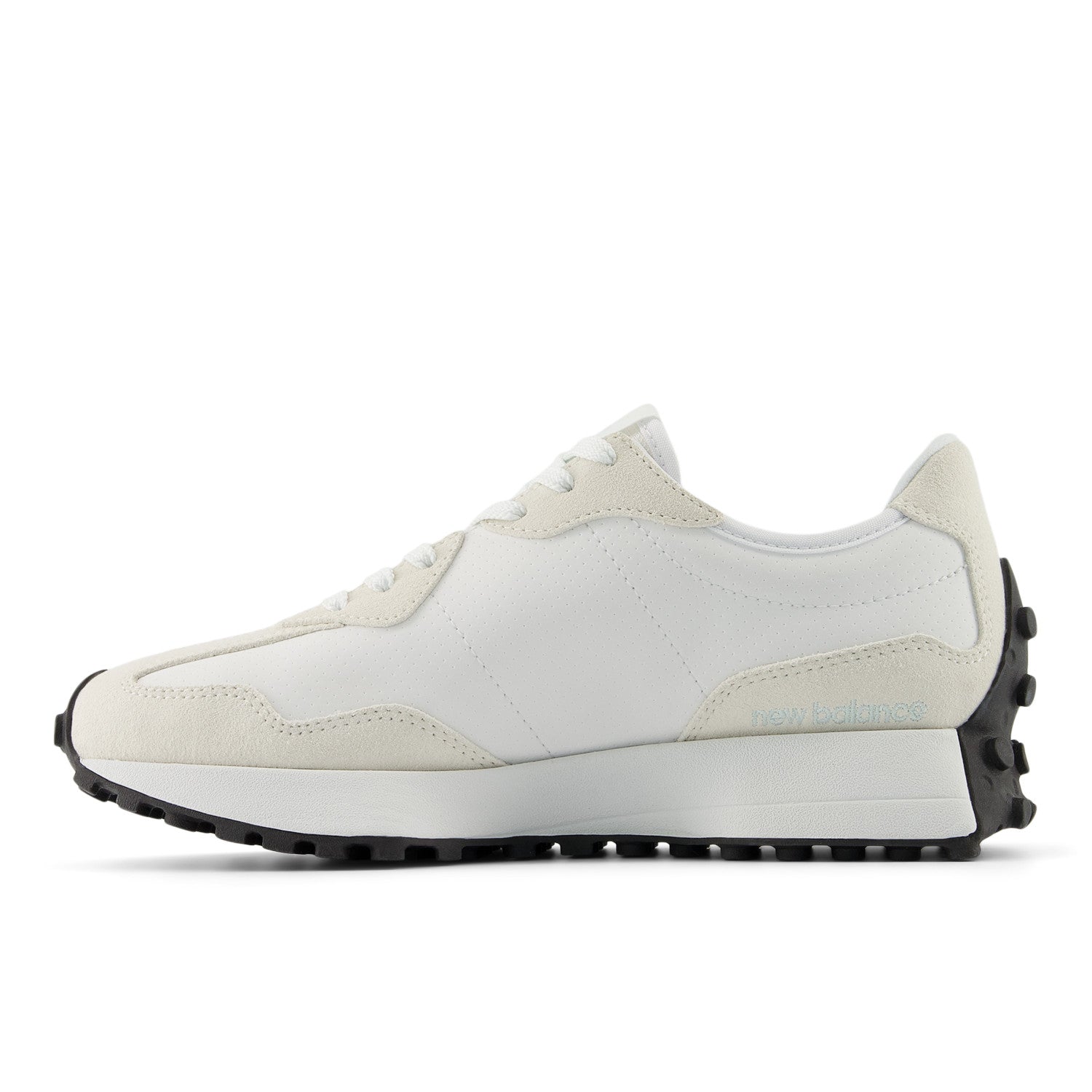 White sneaker with black sole on a white background