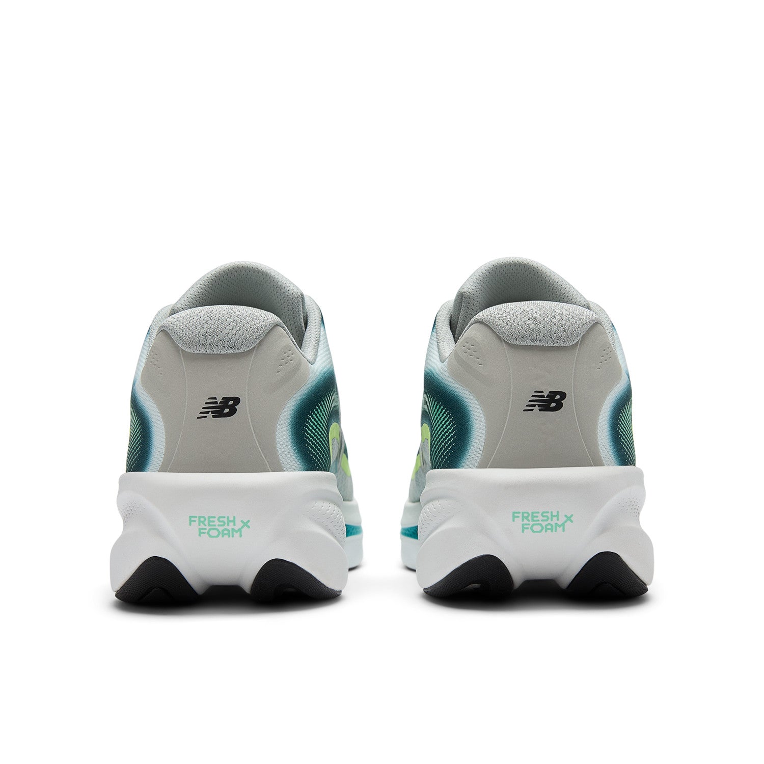 White running shoes with black and green accents on a white background