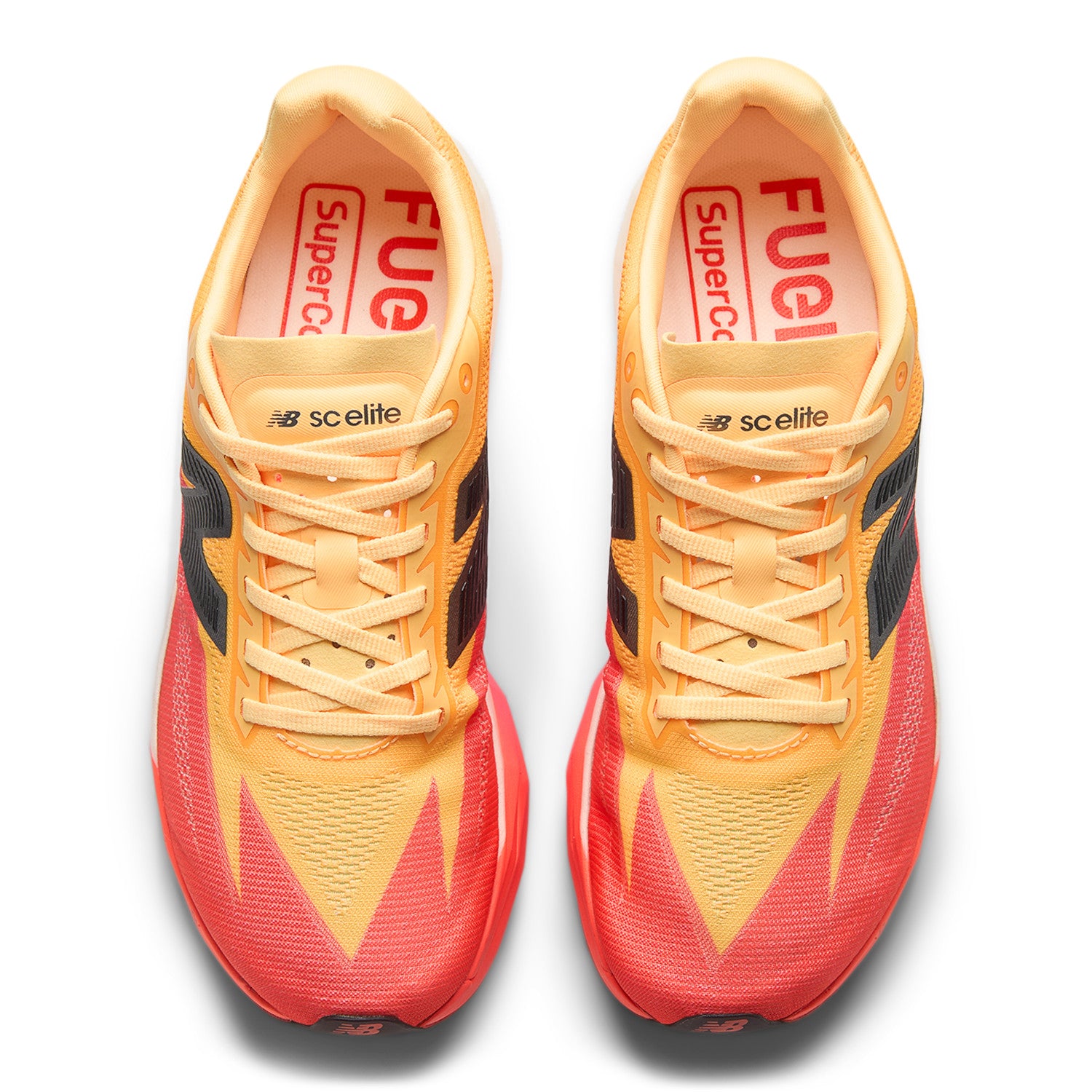 Pair of orange and red running shoes with visible branding on a white background