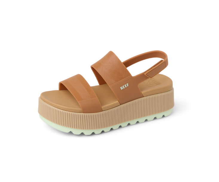 Brown platform sandal with 'REEF' branding on a white background
