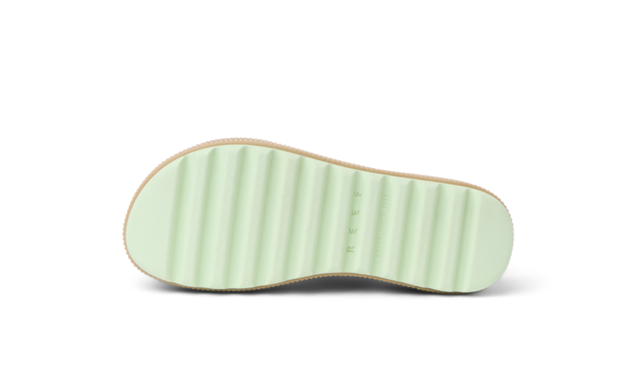 Close-up of a shoe sole with a textured pattern on a white background