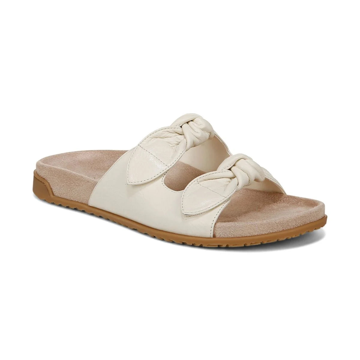 Beige sandal with a brown sole on a white background