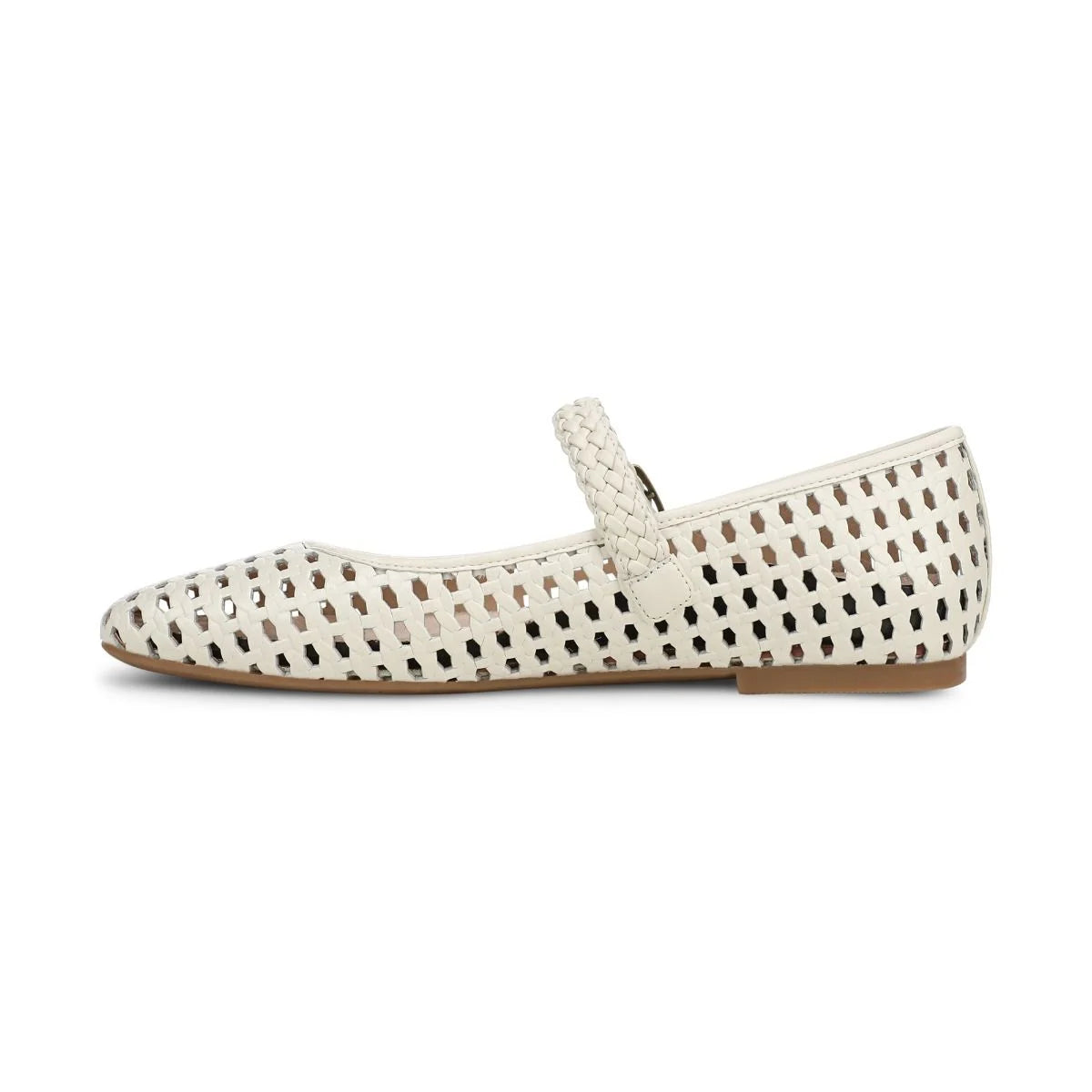 White flat shoe with black perforated pattern on a white background