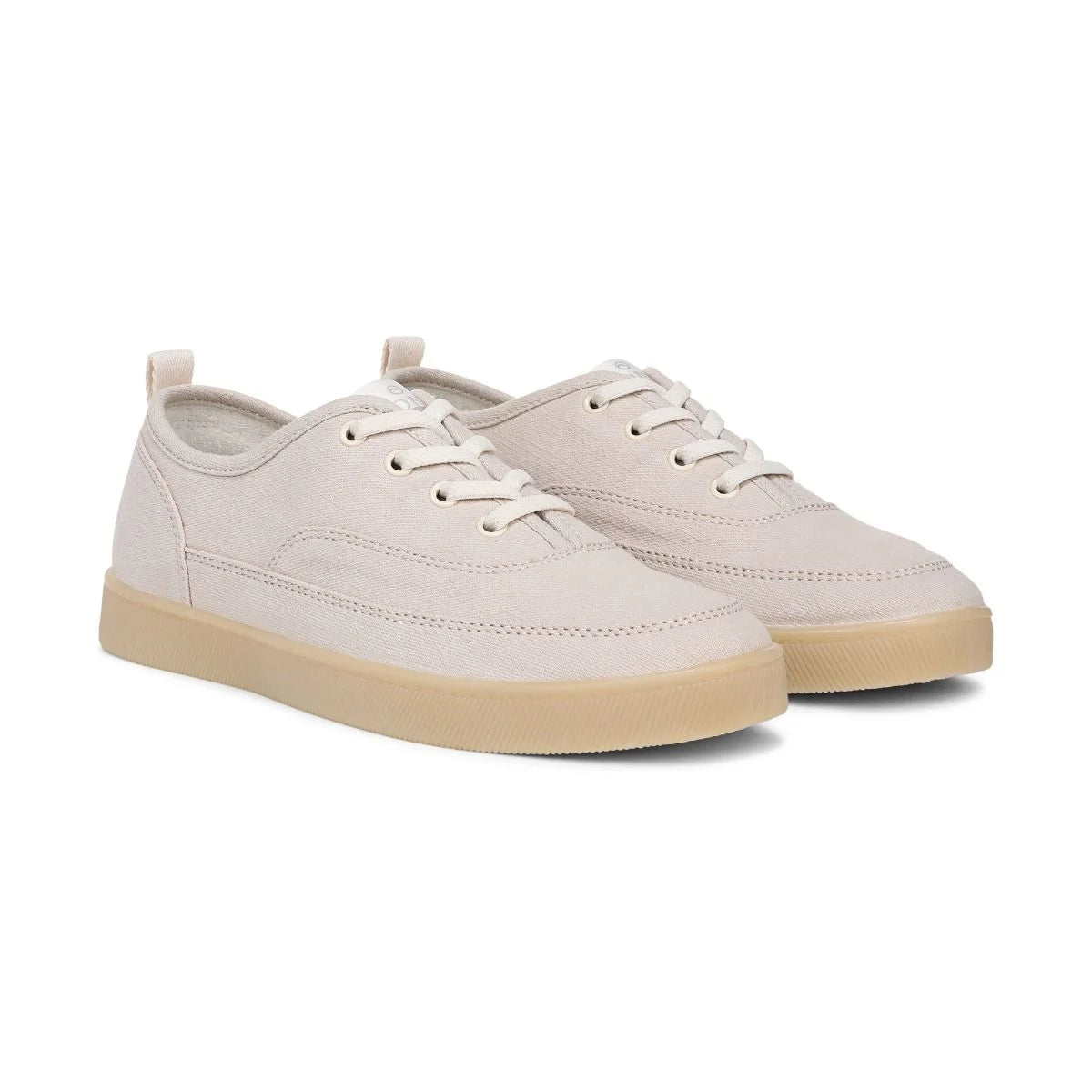 Pair of light gray sneakers with beige soles on a white background