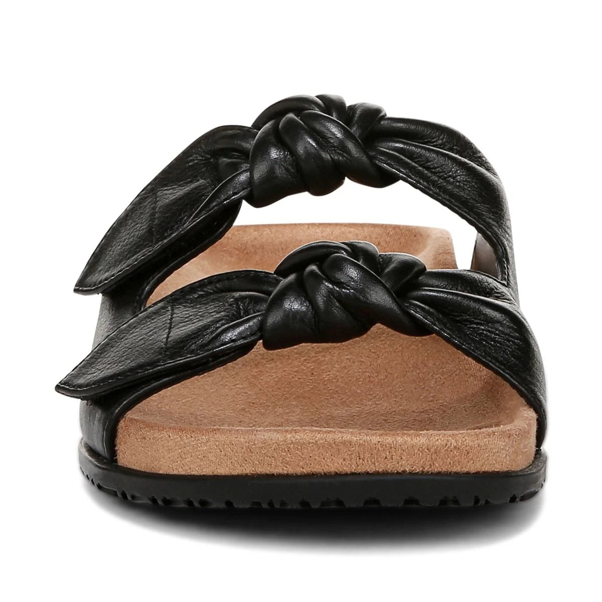 Black sandal with knotted straps on a white background