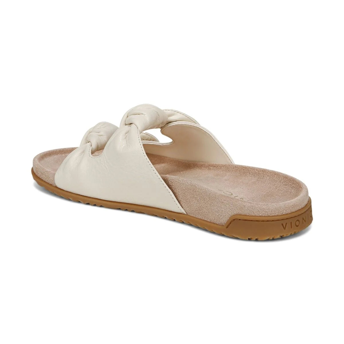 Beige sandal with a brown sole on a white background
