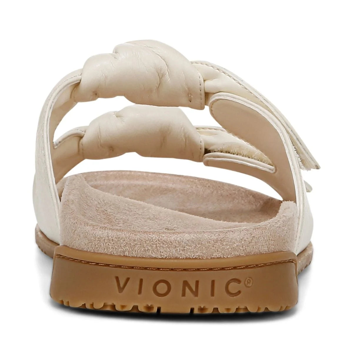 Beige sandal with brown sole on a white background, featuring the Vionic brand.