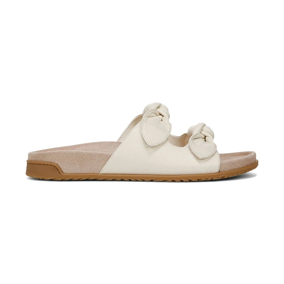White sandal with a brown sole on a white background