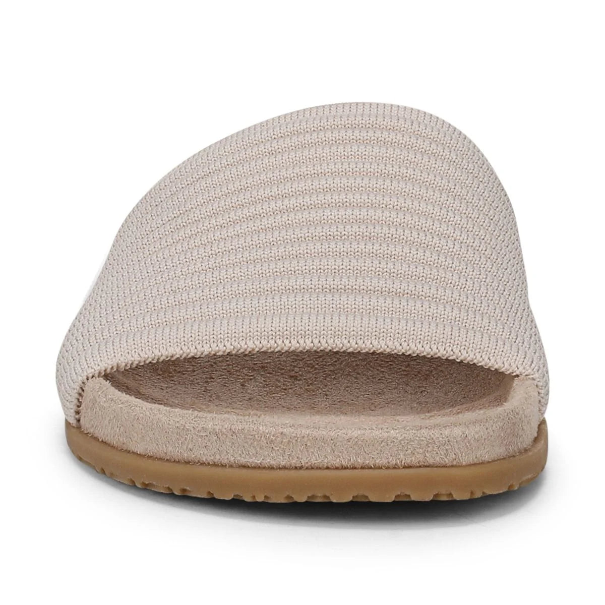 Beige slipper with textured surface on a white background