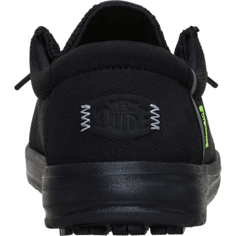 Black shoe with a visible brand logo on a transparent background