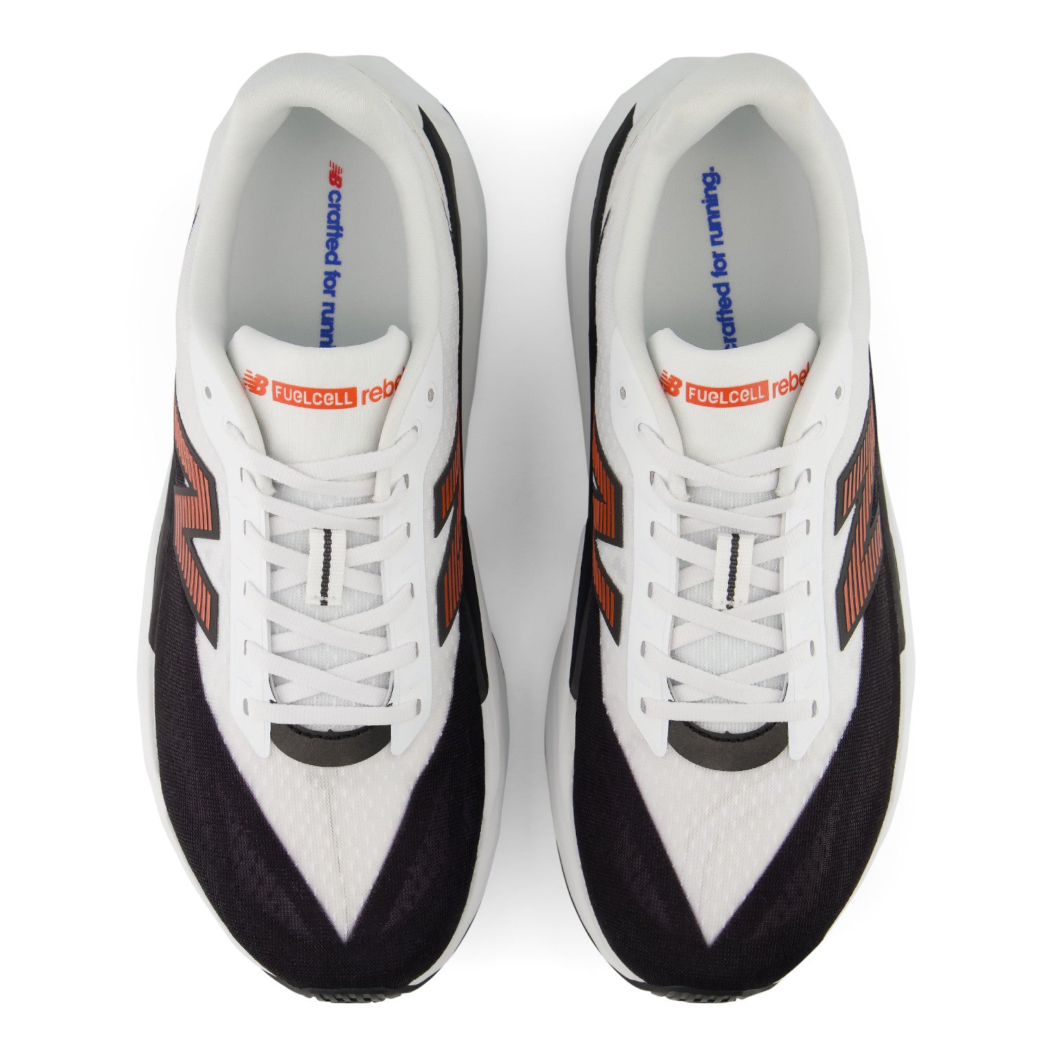 Pair of black and white sneakers with red accents on a white background