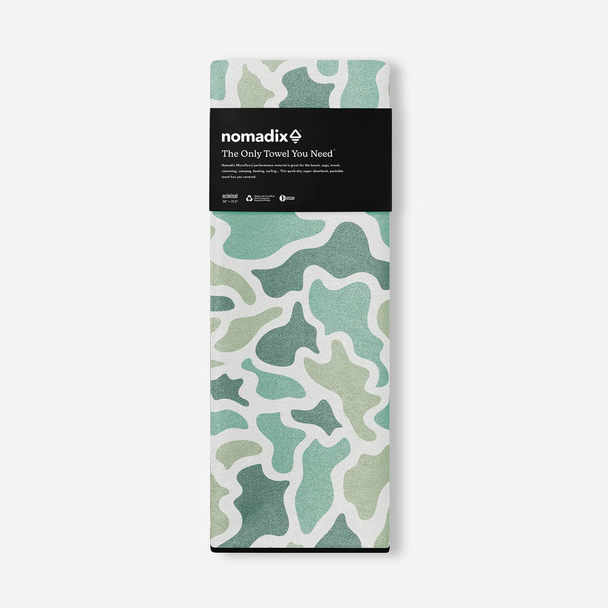 Packaged towel with green abstract pattern and Nomadix branding on a white background