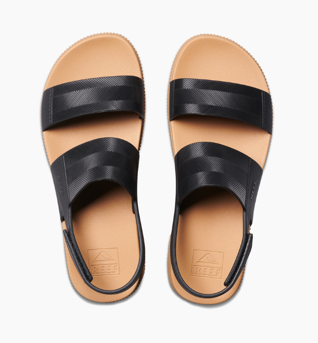 Pair of sandals with black straps on a white background
