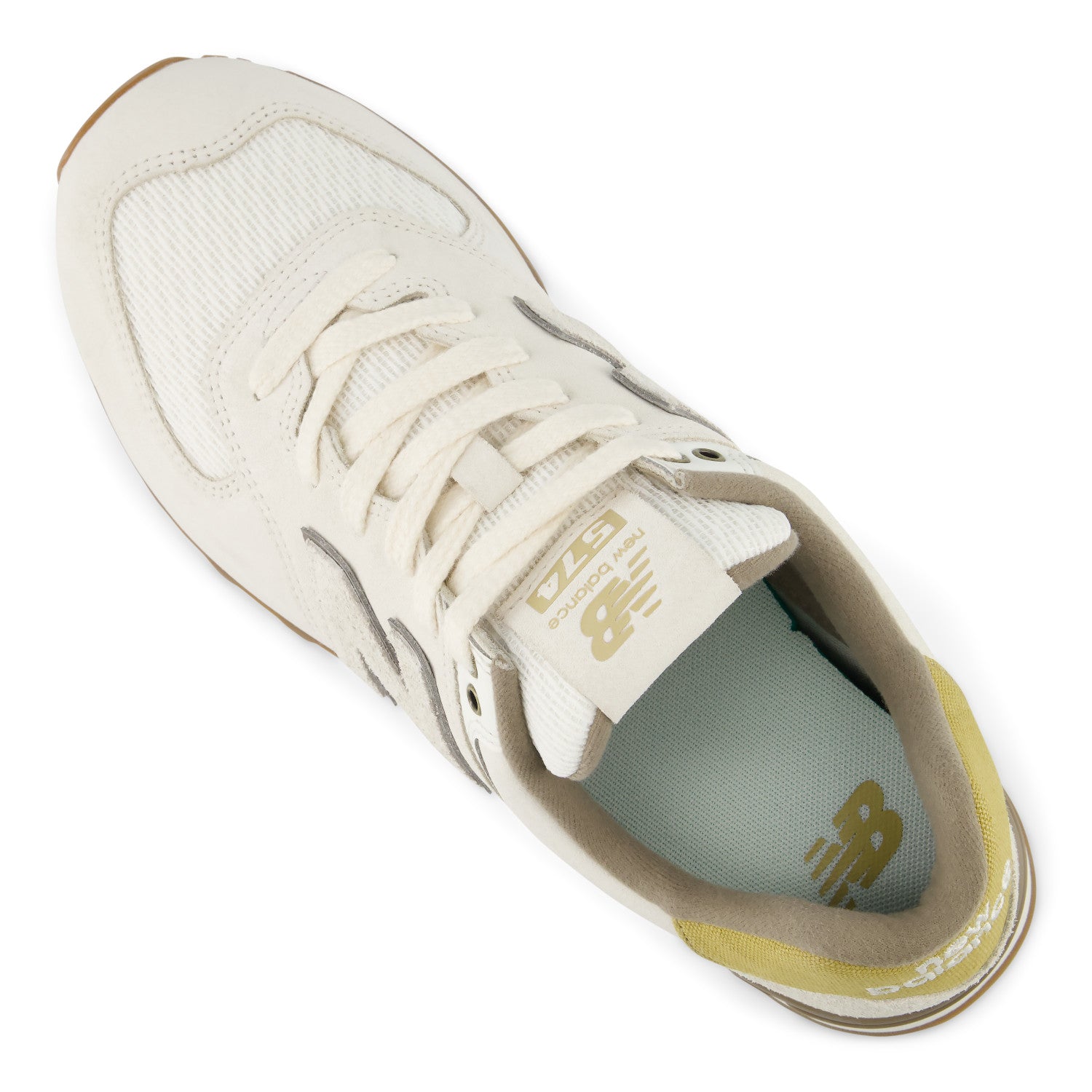 White sneaker with gold accents on a white background