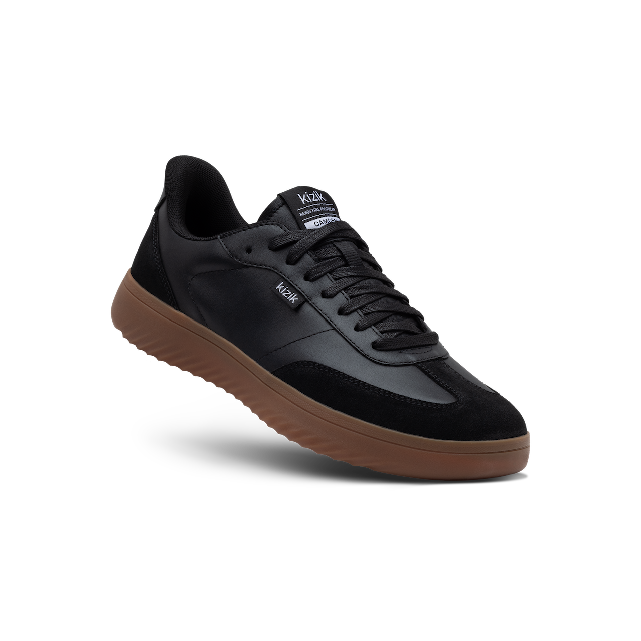 Black sneaker with brown sole on a white background