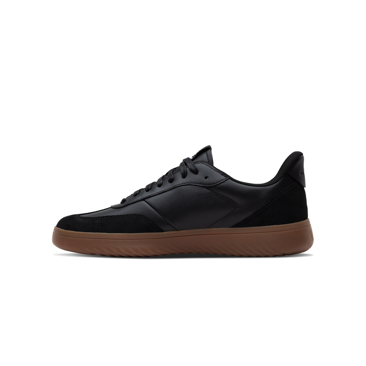 Black sneaker with brown sole on a white background