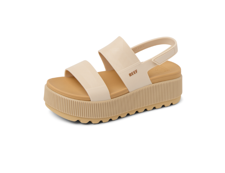 Beige platform sandal with 'REEF' branding on a white background