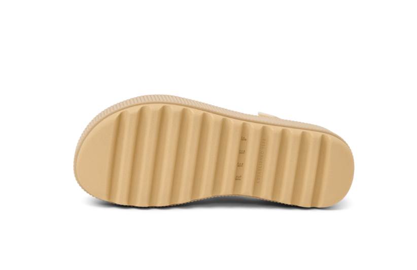 Beige sole of a shoe on a white background