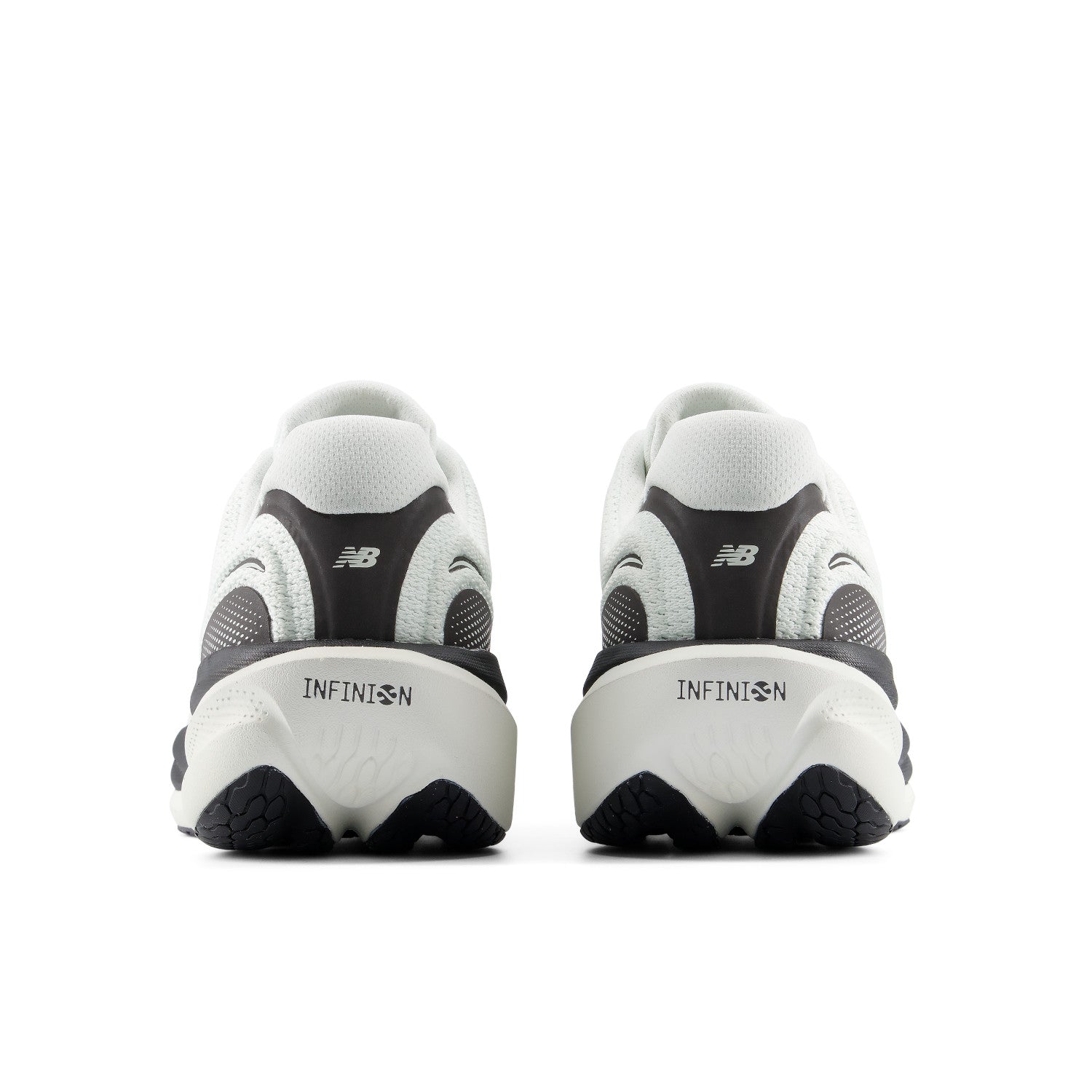 A pair of New Balance Infinity running shoes shown from the rear, featuring a white and black design with the 'NB' logo visible on the heel.